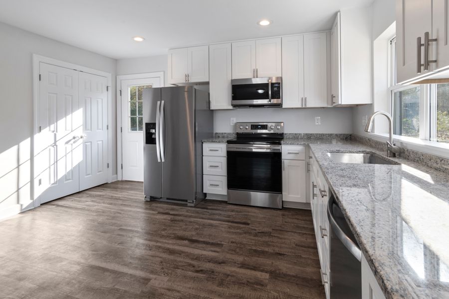 Completed kitchen remodel with granite countertops and new flooring